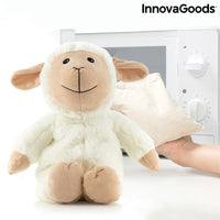 Sheep Soft Toy with Warming and Cooling Effect Wooly InnovaGoods beside a microwave with a heat pack.