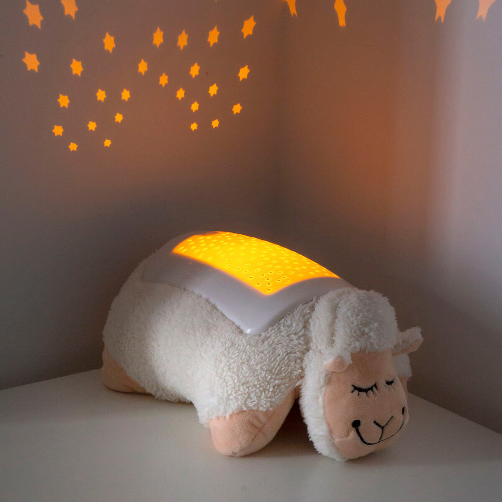Plush Toy Projector Sheep InnovaGoods projecting stars in a cozy room setting.