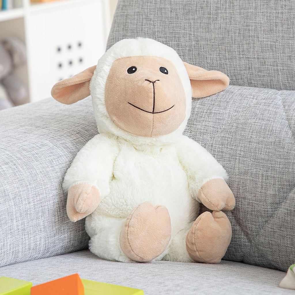 Sheep Soft Toy with Warming and Cooling Effect Wooly InnovaGoods sitting on a sofa, perfect for kids' comfort.