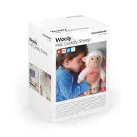 Sheep Soft Toy with Warming and Cooling Effect Wooly InnovaGoods package with child cuddling toy.