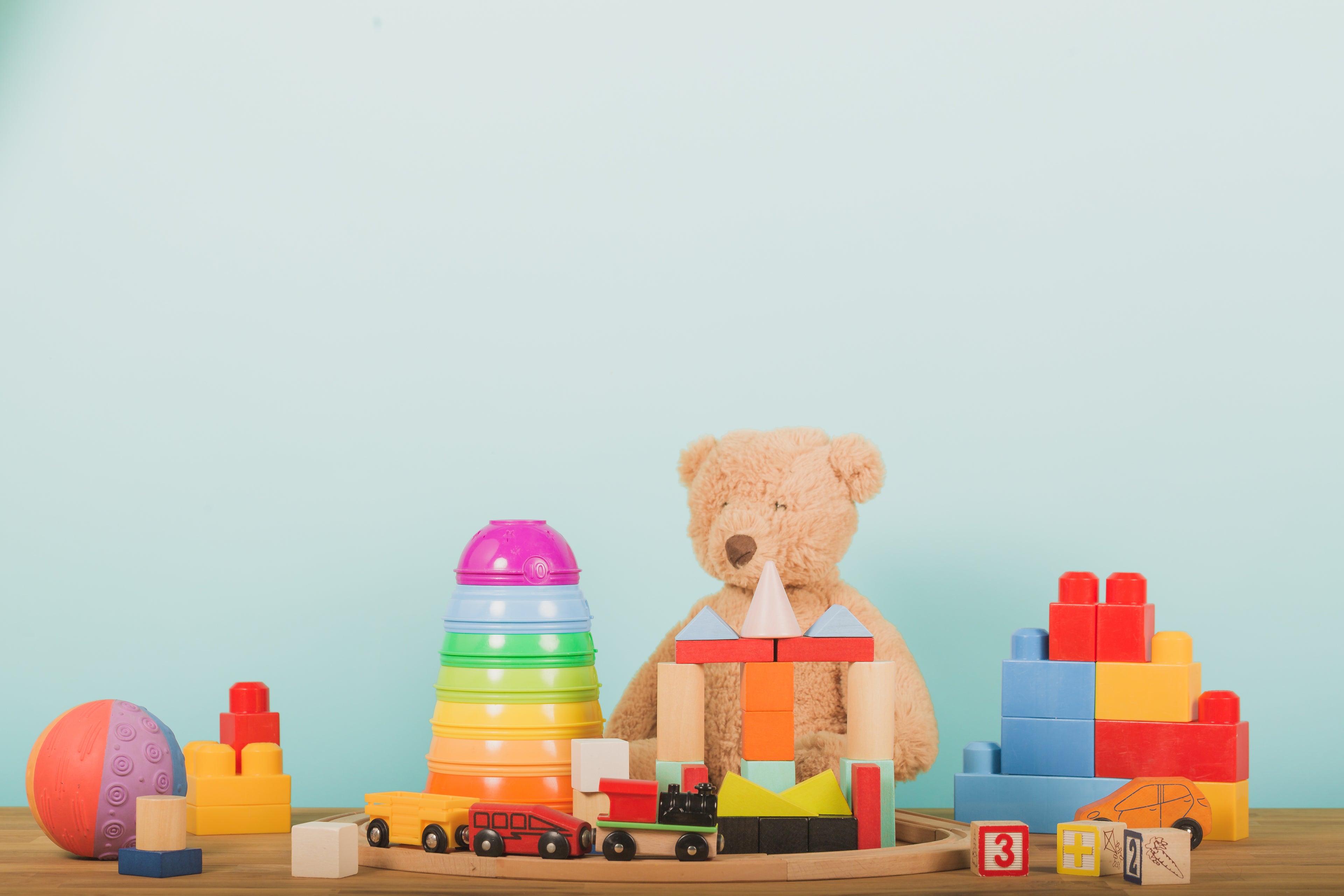 Collection of children's toys with a plain background